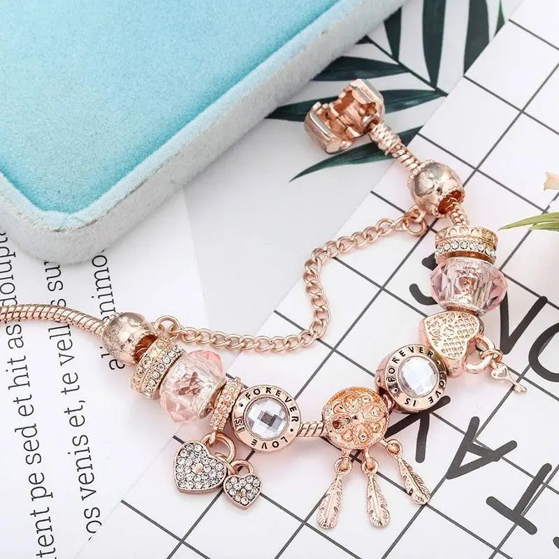 Rosé Traumfänger-Armband mit Charms aus Sterlingsilber enthalten