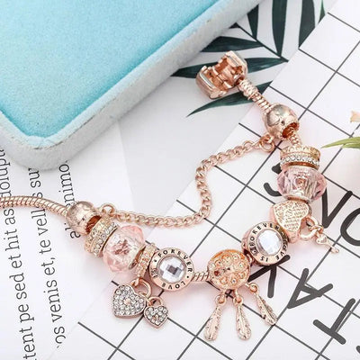 Rosé Traumfänger-Armband mit Charms aus Sterlingsilber enthalten