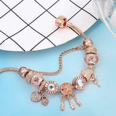 Rosé Traumfänger-Armband mit Charms aus Sterlingsilber enthalten